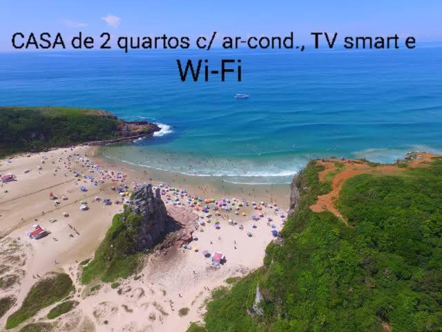 CASA completa em TORRES-RS - O MELHOR CUSTO BENEFICIO na mais bela praia Gaúcha - Cozinha - Banheiro - Ar condicionado - Smart TV 32 Android Apps Youtube - Netflix - Prime Vídeo e Wi-Fi - Estacionamento - Acomoda até 10 pessoas - Anfitriã Superhost n Villa Exterior foto